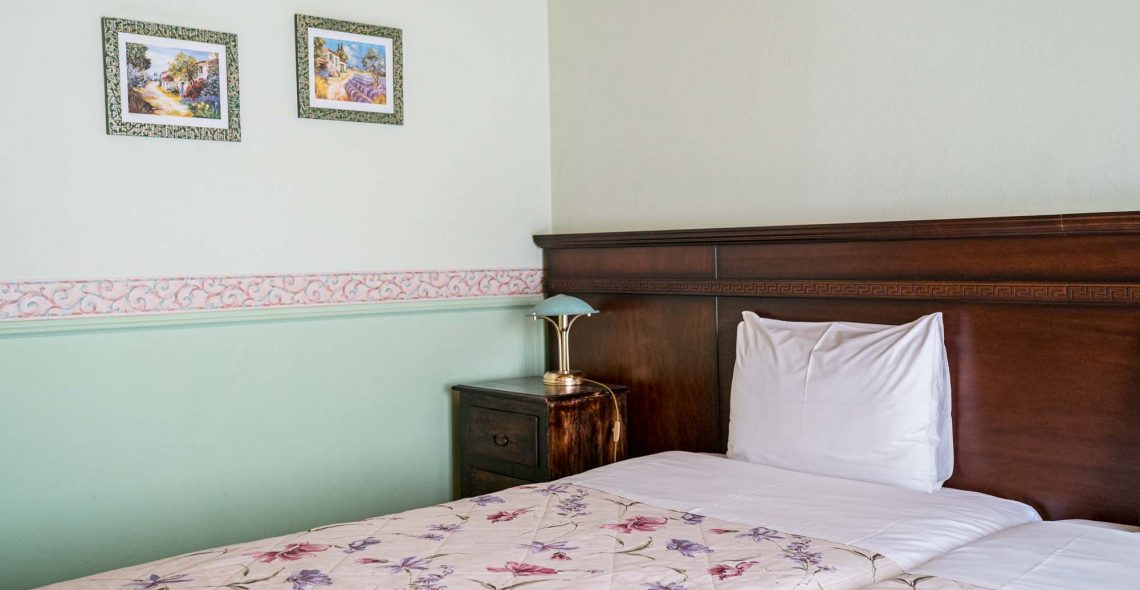 standard-double-room-two-single-beds-room-blue-beds